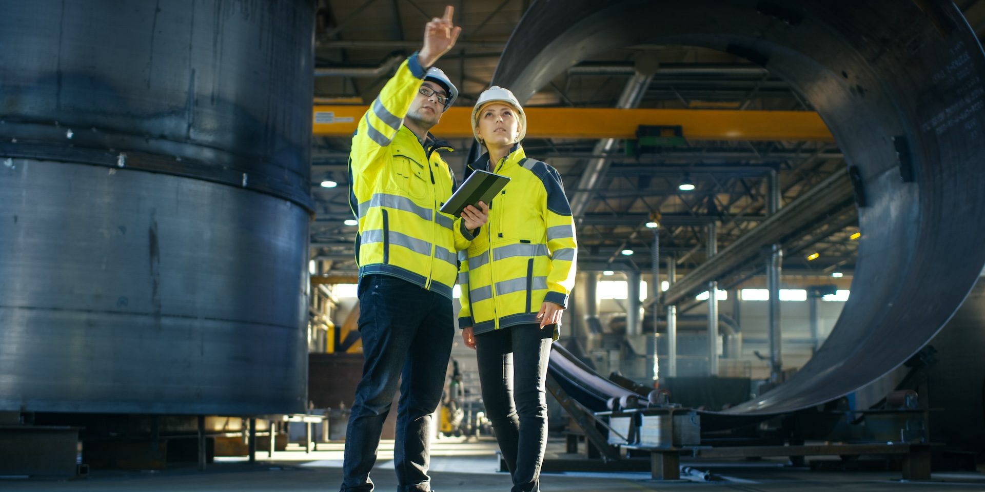 Industry workers using a tablet